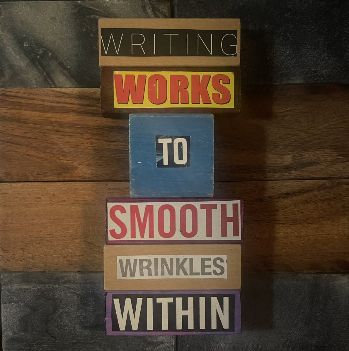 PaulWHankins's tweet photo. The backdrop for these small #BlockheadPoems are wood and stone coasters I found at the local Aldi. #BlockheadPoetry #Room407 https://t.co/xznzN72Jj6