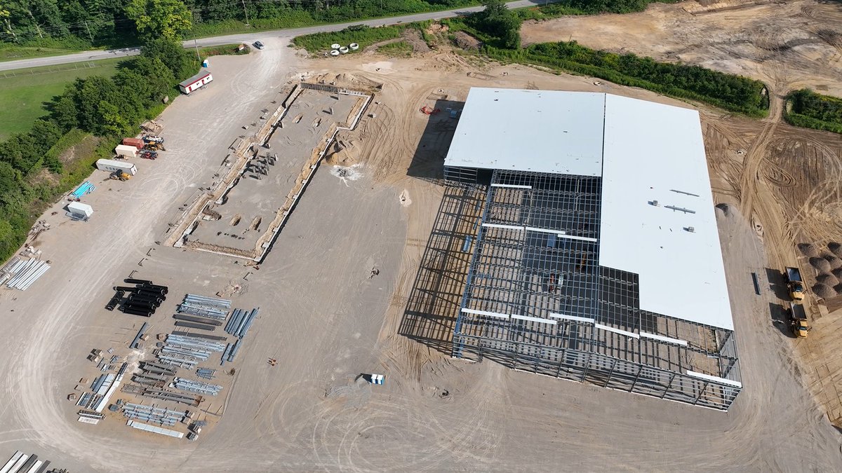 GrassmereDB's tweet photo. Progress at @ArmtecLP's Tillsonburg Site. The standing seam roof paneling is being installed on one pre-engineered metal building as we complete the foundation walls and piers in preparation for the installation of the second pre-engineered building. https://t.co/1kF0tVX9dm