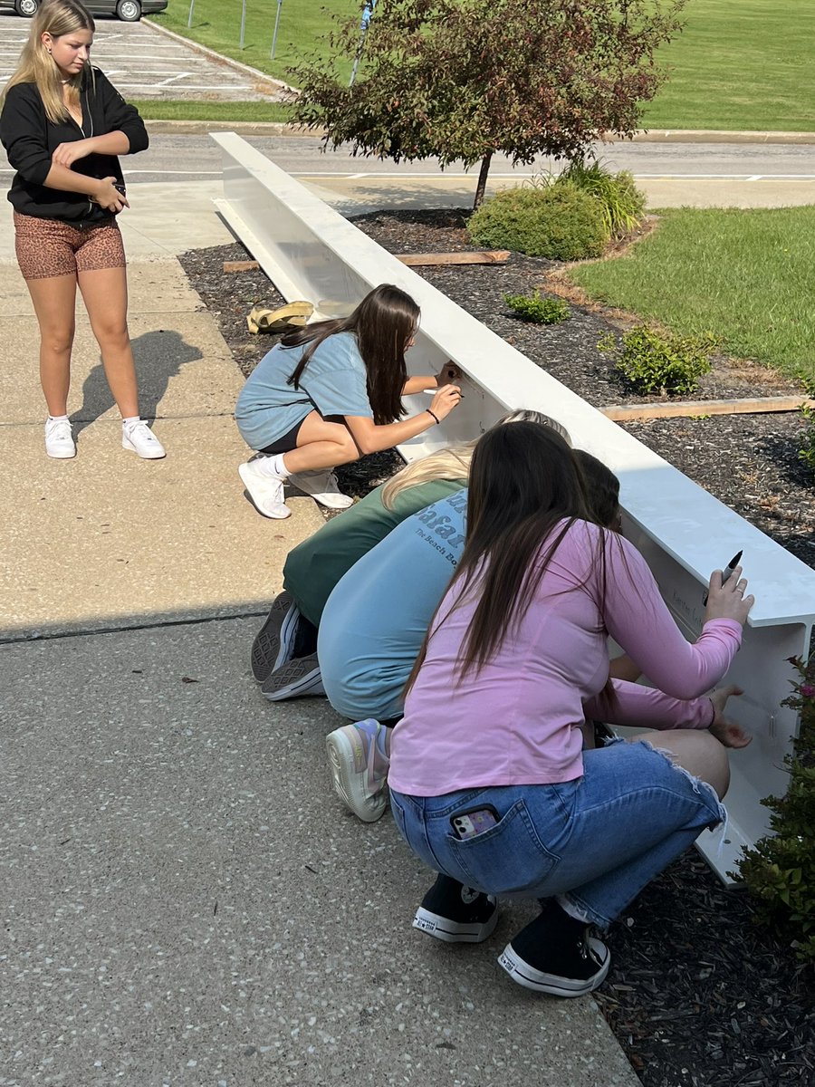 CHS students getting to sign their name on a steel beam that will be exposed in the new CHS #WeAreCloverleaf