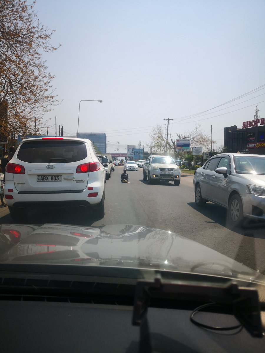 RTSA and/or Traffic Police should act to stop this behaviour. How on earth can it be normal for these people to sit in the middle?of a busy road?