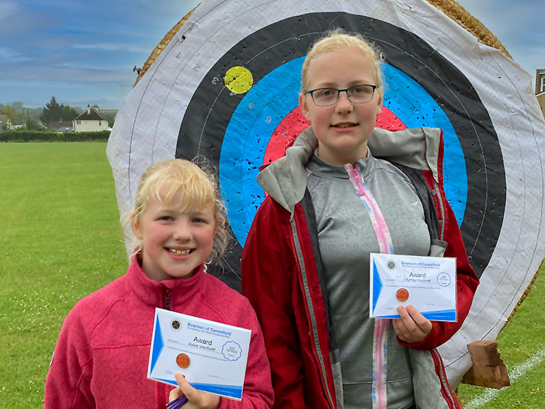 Dulcie and Lily-May receive their first 252 awards - well done girls. The next is not far away. #Archery # Minehead # Taunton #Williton