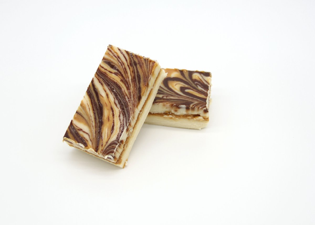 Happy Friday!  Enjoy your weekend with some of our delicious Tiger Butter Fudge!!  bit.ly/3Q7lDvz