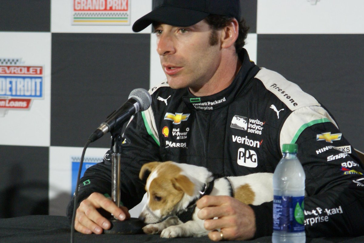 detroitgp's tweet photo. It’s #NationalDogDay and we are flashing back to one of our favorite track pups - @NormanPagenaud! Remember 2016 when Norman met with the media after dad @simonpagenaud finished as runner up on Sunday at the @Chevrolet #DualInDetroit at #DetroitGP? He did a doggone good job. #FBF https://t.co/3Xu6fLlSor