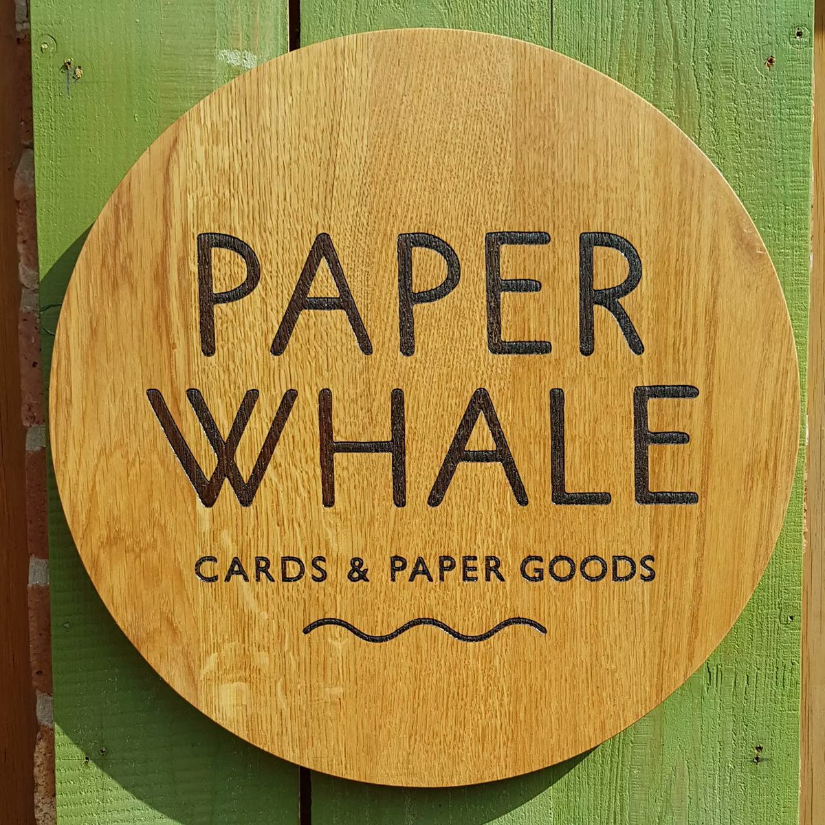 The sun came out to show off the new Paperwhale studio shop sign which went up today. Here it is in all it's sunny glory. Big thanks to local craftsman <a href="/iwoodmade/">Ian Wood</a> for a beautiful job. I absolutely love it and it compliments everything perfectly 🌿👌