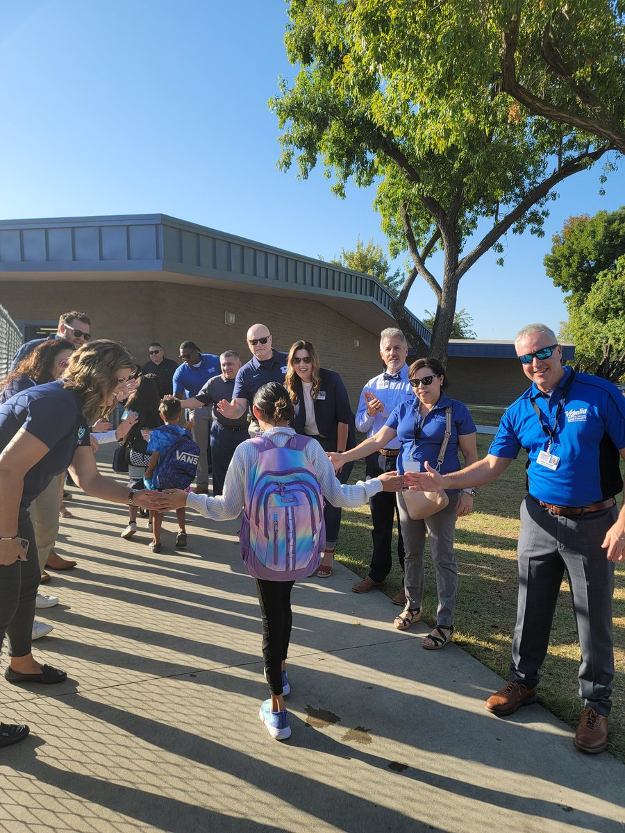 Great way to start our morning! VUSD Cabinet members and Superintendent Shrum greeting Warriors. First High-Five Friday!#VisaliaUSD