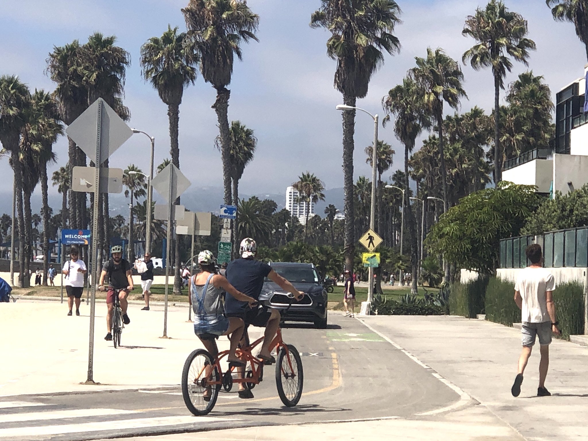 Cars Driving Down The Venice Boardwalk Shacked