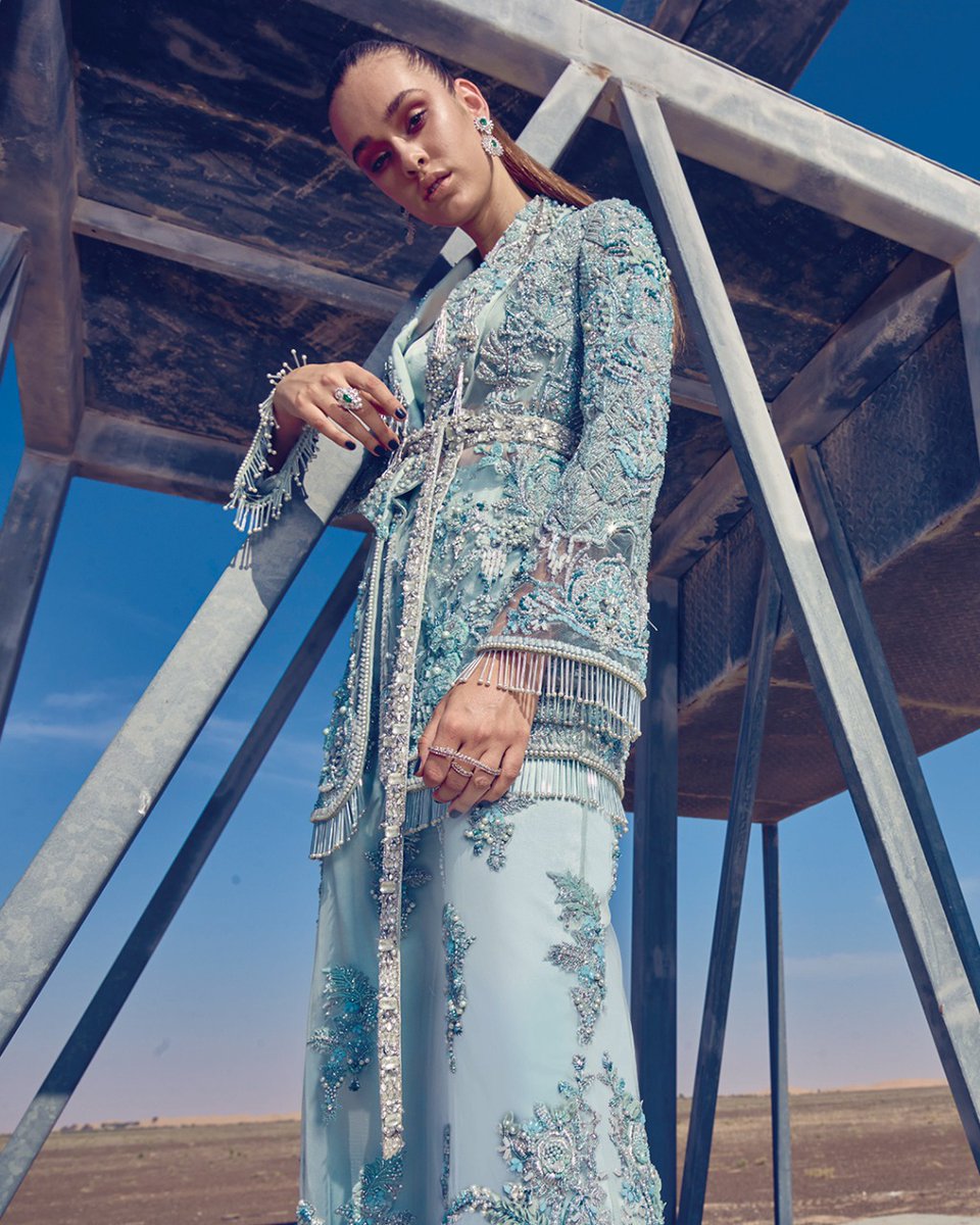 Meticulously crafted and continuously pushing the boundaries of fashion, Élan brings drama and refinement to couture with incandescent and contemporary ensembles in our 'Bejeweled Rose' collection.