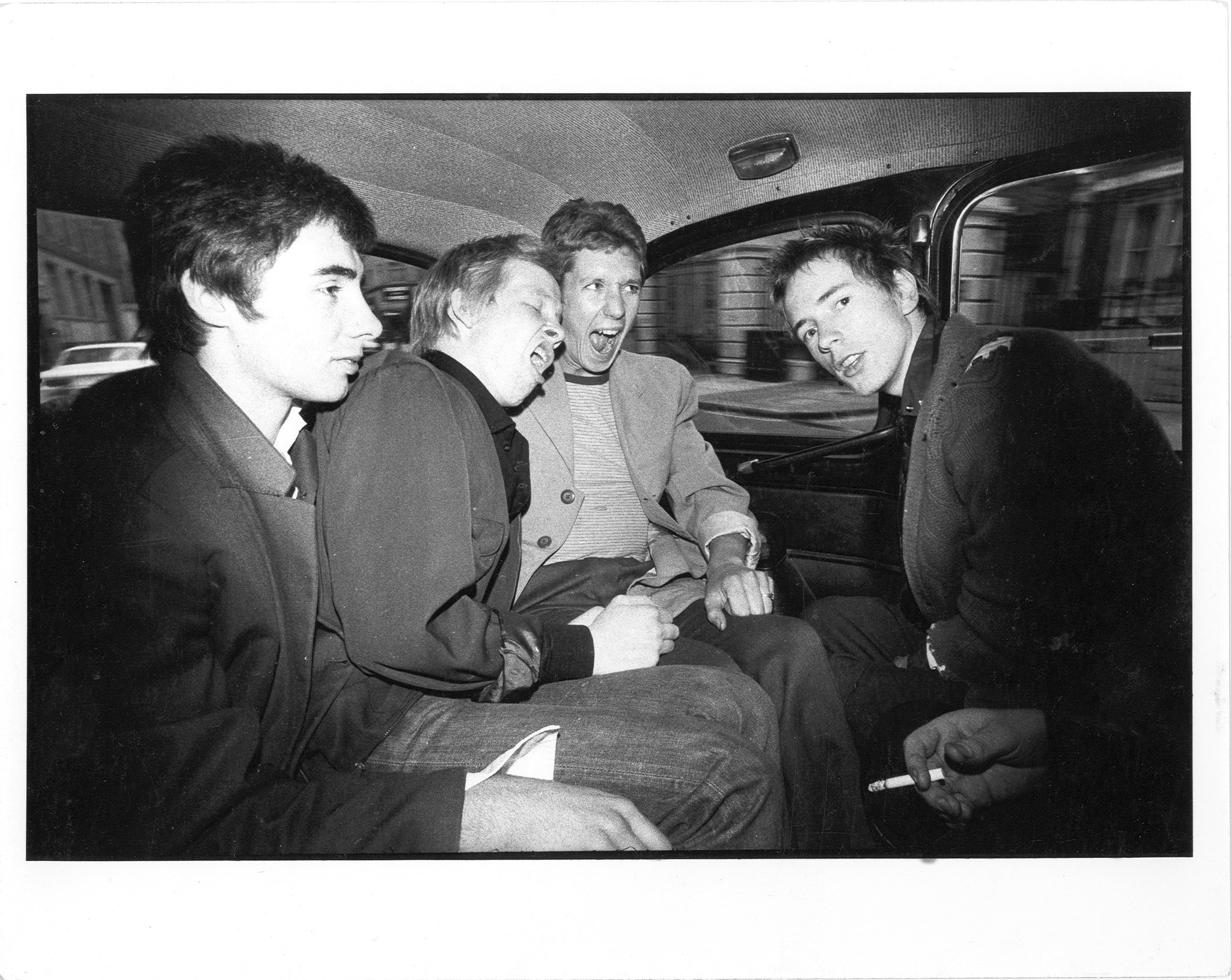 Happy birthday to Glen Matlock - pic by Stevenson, Sex Pistols in taxi, April 1976 