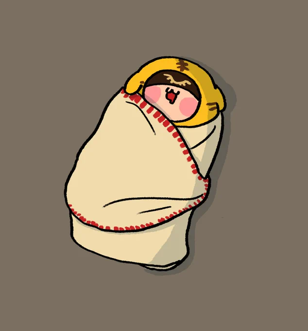 タオルに包まれて寝るコトラちゃん 