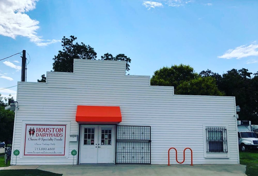 dairymaids's tweet photo. New awning, fresh paint job…our beloved old building is looking pretty sharp.
The second photo is the shop as it looked in the 1930s when it was Danna’s Market. The Dannas sold cheese too, along with oysters, pork &amp; beans, and haircuts!
Come by and visit us in the Heights! https://t.co/Fh8yDSZX8l