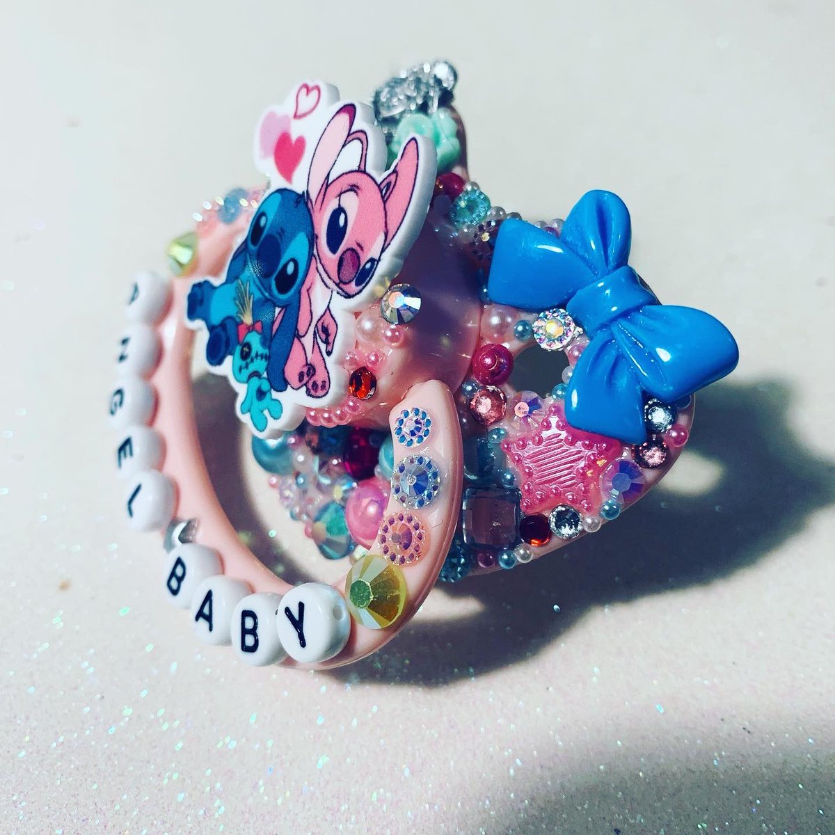 kinksparkle's tweet photo. How cute is this recent Angel & Stitch custom?! Please get in touch if you’d like to order!
.
#adultpacifier #ddlg #abdl #mdlg #ddlb #mdlb #daddykink #mommykink #littlegear #paciseller #adultpaci #adultbinkie #cgl #littlecommunity #custompacifier https://t.co/yNA1KWqZtp