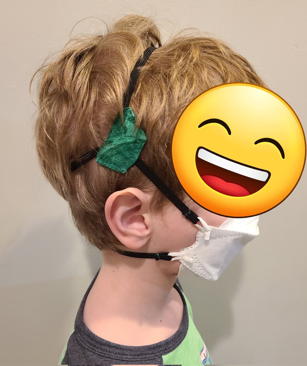 Image of child wearing converted "Y" strap KN95 mask.