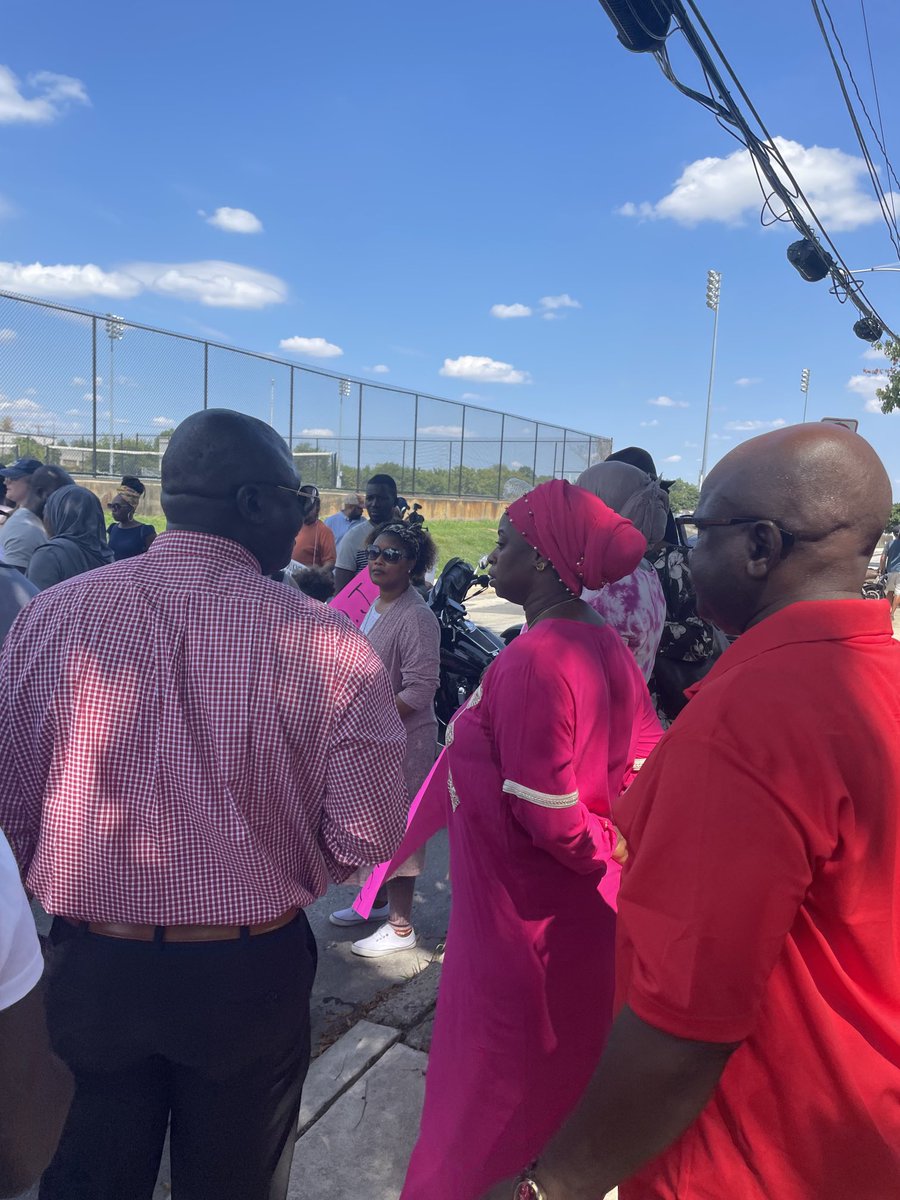 dtbusiness's tweet photo. Tenneh Kromah stands next to Abu Bility, Fanta’s uncle, in front of the Academy Park High School football field, where her 8-year-old daughter was shot and killed a year ago. #justiceforfanta #fantability #sharonhill #academypark https://t.co/eQiTg0aKXT