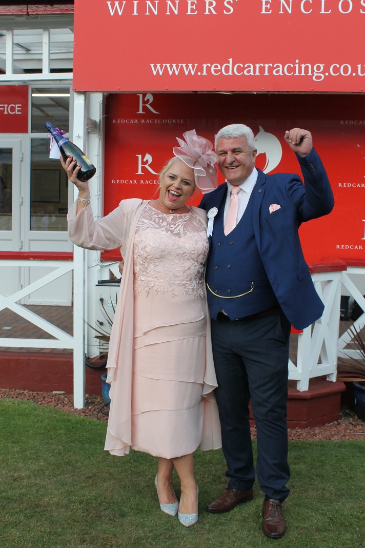 Redcarracing's tweet photo. Nurse Angela Champion got great value out of the salmon outfit she bought for daughter Michaela’s wedding. It helped her win the Best-Dressed Couple competition with her partner, steelworker Les Shepherd. The couple, from Redcar, are pictured with judges @PamRoyleTV &amp; Tom Power https://t.co/KcePnvpFTa