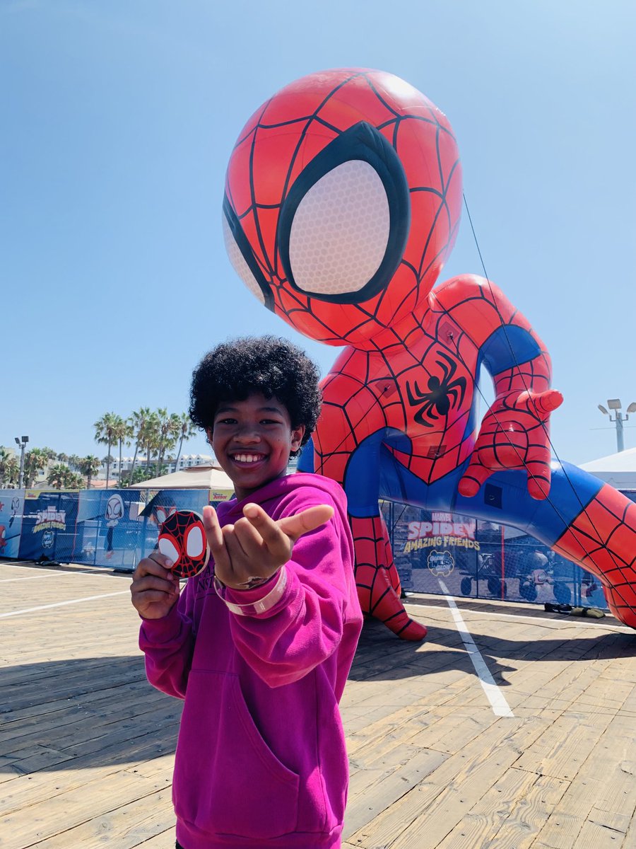 Borys_Kit's tweet photo. Thwip, thwip; Jakari Fraser, who voices Miles Morales on SPIDEY AND HIS AMAZING FRIENDS, holds his own…and his own cookie…at a Spidey activation that took over the Santa Monica Pier this weekend. https://t.co/63lpx8fgbr