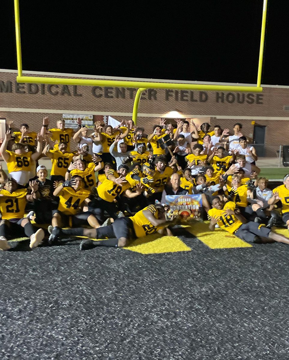 Coachclintburns's tweet photo. Incredible game last night for the 124th installment of the #battleoftheax!! Hat is off to the bearcats for way they played. Owen and Rooster were excited to get the photo op with the hardware! https://t.co/EH8OaOw84t