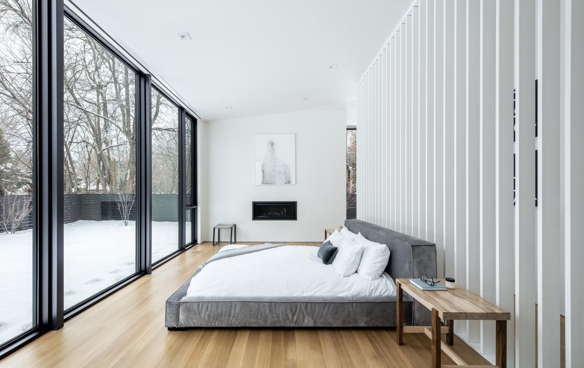 A wall of windows keeps this #bedroom well-lit during the day. What else is interesting to you about this #modernhome?  cpix.me/a/151830621