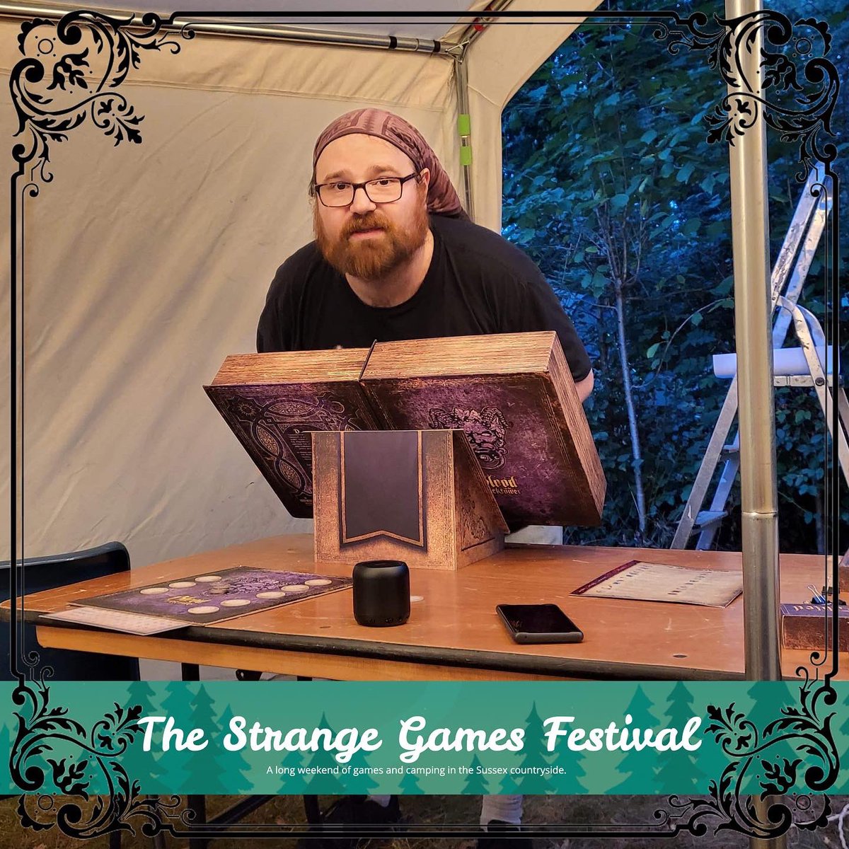 BloodClocktower's tweet photo. Clocktower: Camping style 😈

More of Daddy Ben out and about, this time out in the great outdoors at the Strange Games Festival happening this long weekend in Sussex 🇬🇧

#boardgameweekend
#boardgamelife
#murdermystery done differently 
#bloodontheclocktower 

💜 Andy

❤️🩸🕰 https://t.co/jzbx41go5s