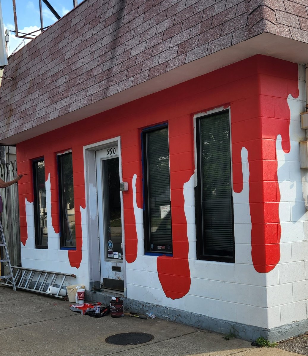 My mom and I are working to open a horror bookstore this fall, and we painted the exterior today 👀