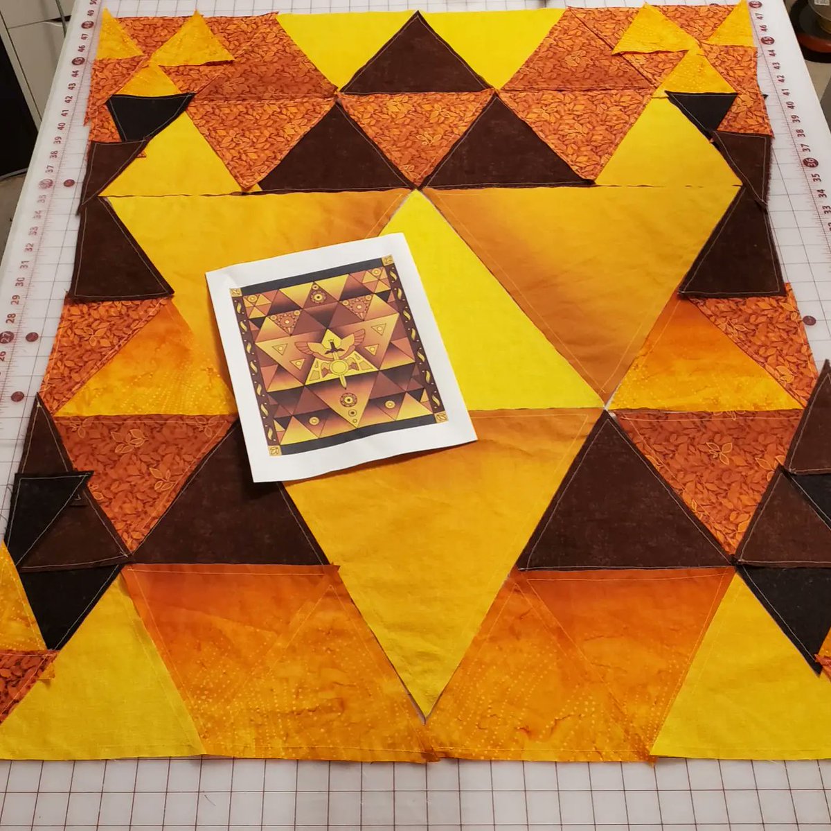 After days on end of staring at stacks of triangles, seeing the whole layout is actually really striking. #theowlhousefanart #fanquilt