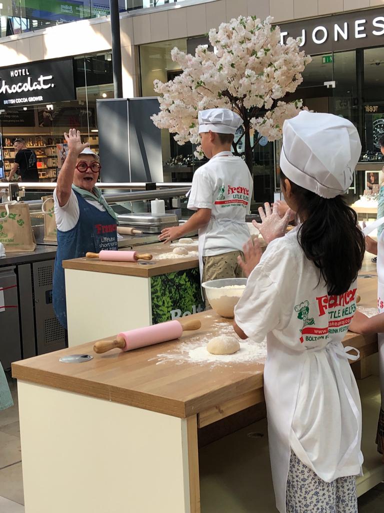 BoltonFoodFest's tweet photo. 🍕 A pizza the action - enjoying a pizza making masterclass in the Market Place. https://t.co/3GdoTYff9S