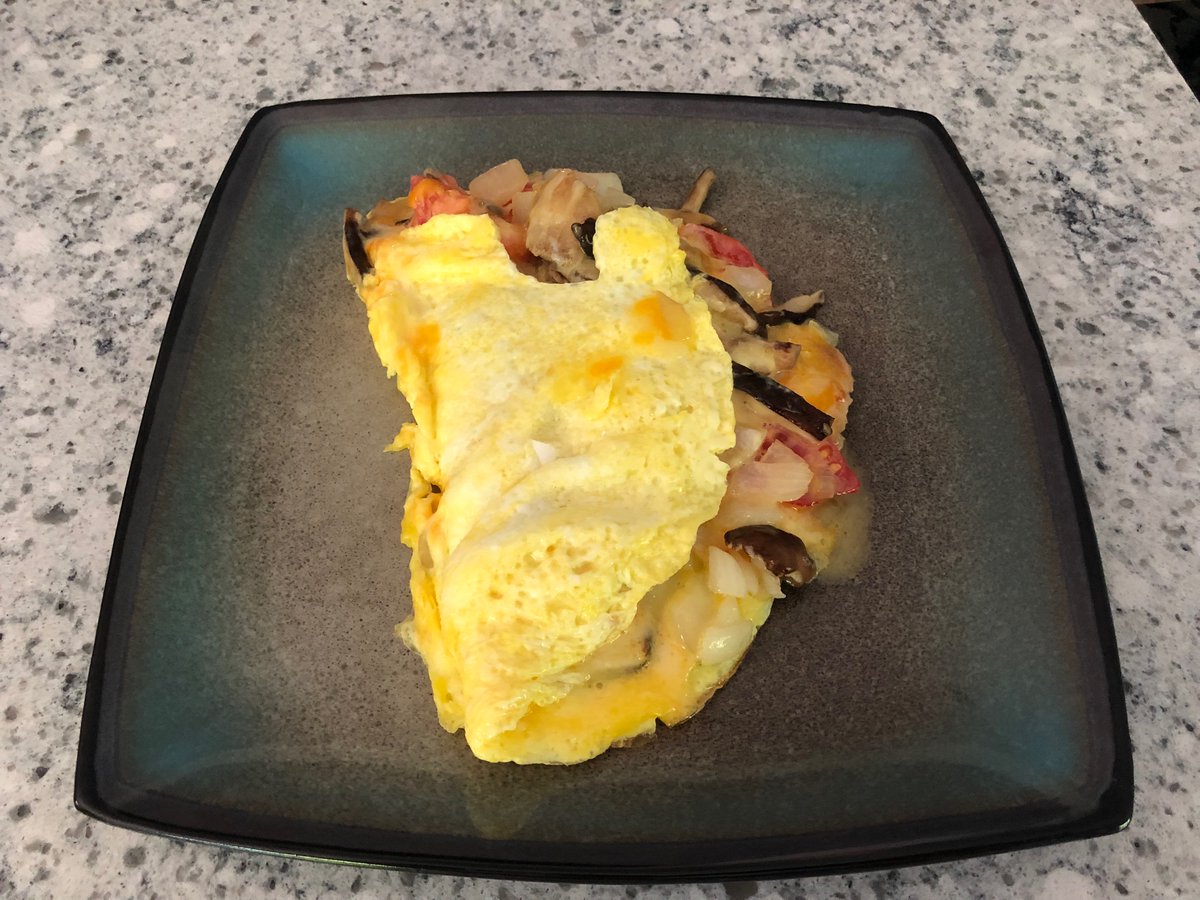 I picked up some fresh shiitake and lions mane mushrooms from the local farmers market.  Added some tomatoes from our garden.  
Then milked the cow and gathered eggs (ok , I made this part up but wish it were true). Cooked up a little breakfast omelette. 
It Was delicious