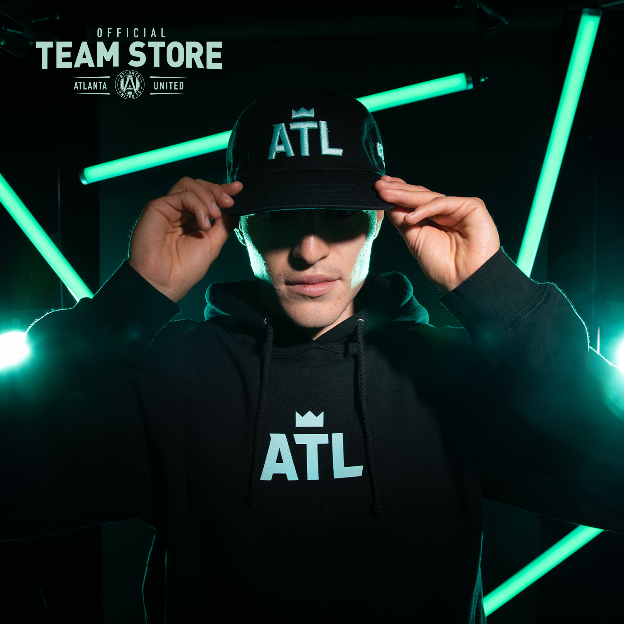 Ronaldo Cisneros wears a cap and hoodie from the new #ATLUTD Black + Mint Collection. Available today at Mercedes-Benz Stadium. 