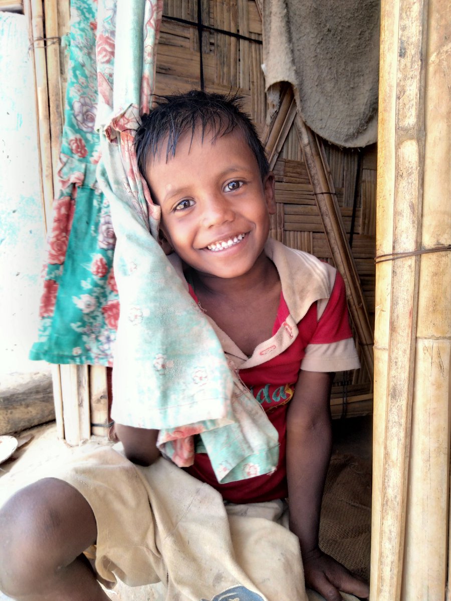 RoMonSurAli3's tweet photo. A smiling face of a Rohingya boy with shyness in the Cox's Bazar, Bangladesh. 
#RohingyaBoy #rohingyarefugee #portrait #shyness #curtain 
#door #smile #face #teeth 
#CoxsBazar #bangladesh 
#romonsuraliphotography https://t.co/b0TGVlSKyx
