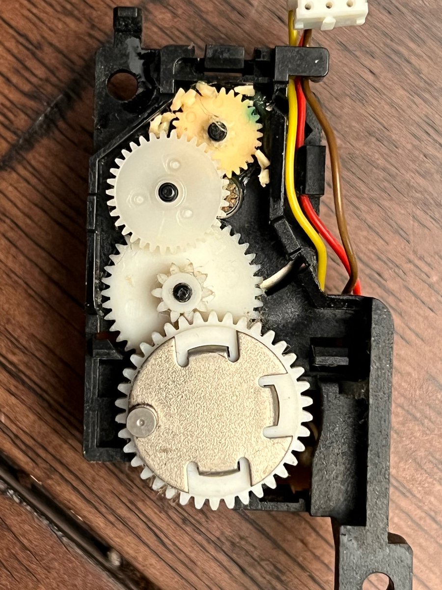 iNikkor's tweet photo. My Apple IIgs floppy drive started making a buzzing sound after archiving around a dozen disks.  I opened it up and saw this destroyed gear.  😢 https://t.co/XyXVhgojqK