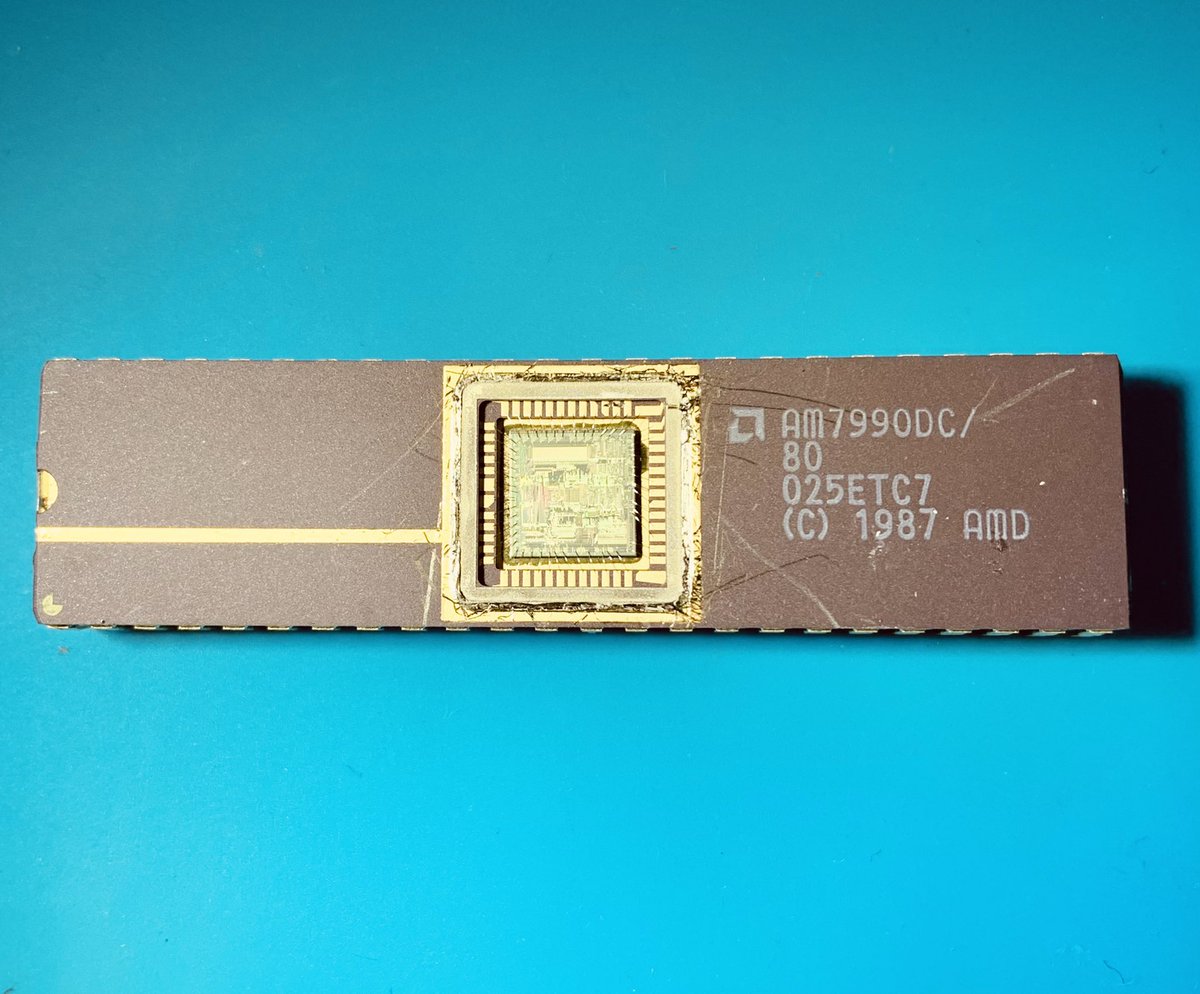 duke_cpu's tweet photo. This #vintage ethernet controller of #AMD is full of designer initials and scribbles. One of the #silicondoodle is a #trombone - the world’s smallest, probably. Real #chipart from 1983! #cpuduke https://t.co/66lqCD1LuC