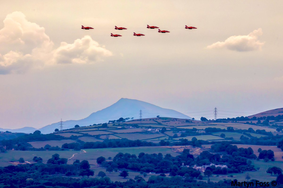 The <a href="/rafredarrows/">Red Arrows</a> in Wall formation on the run into Rhyl Airshow. Mount Snowdon making a picturesque backdrop 🏔 #redarrows #rhylairshow