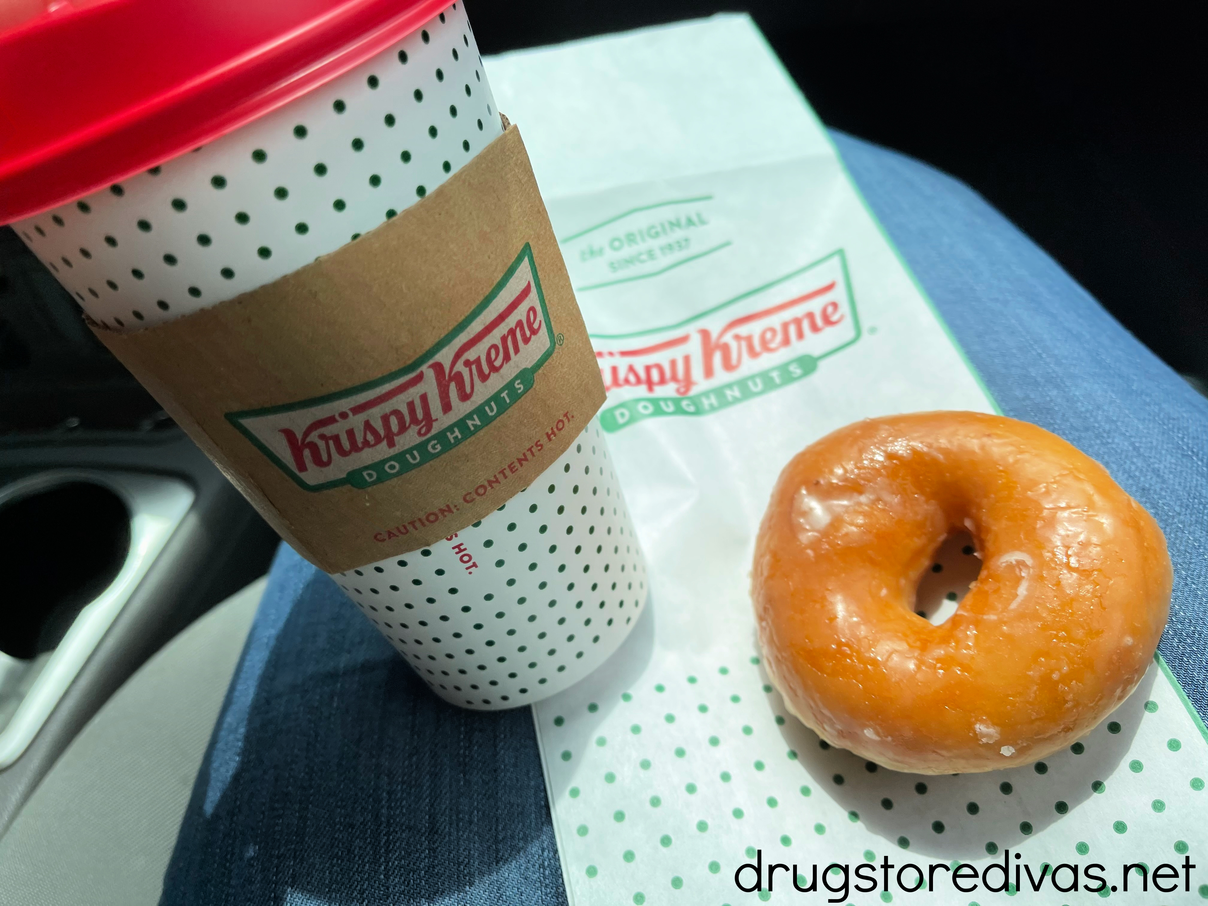 A Krispy Kreme doughnut and coffee.