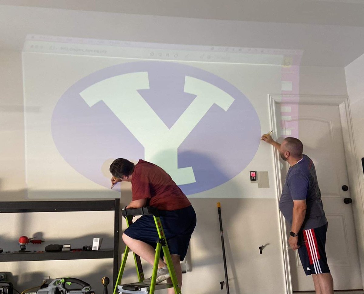 kiraterry's tweet photo. We're ready for the season over here. Helped my dad paint a #BYU logo on his new garage wall today. His request: make it big &amp; royal blue. Check &amp; check, dad. #BYUFootball #gocougsgo https://t.co/EHCSUoMVhc