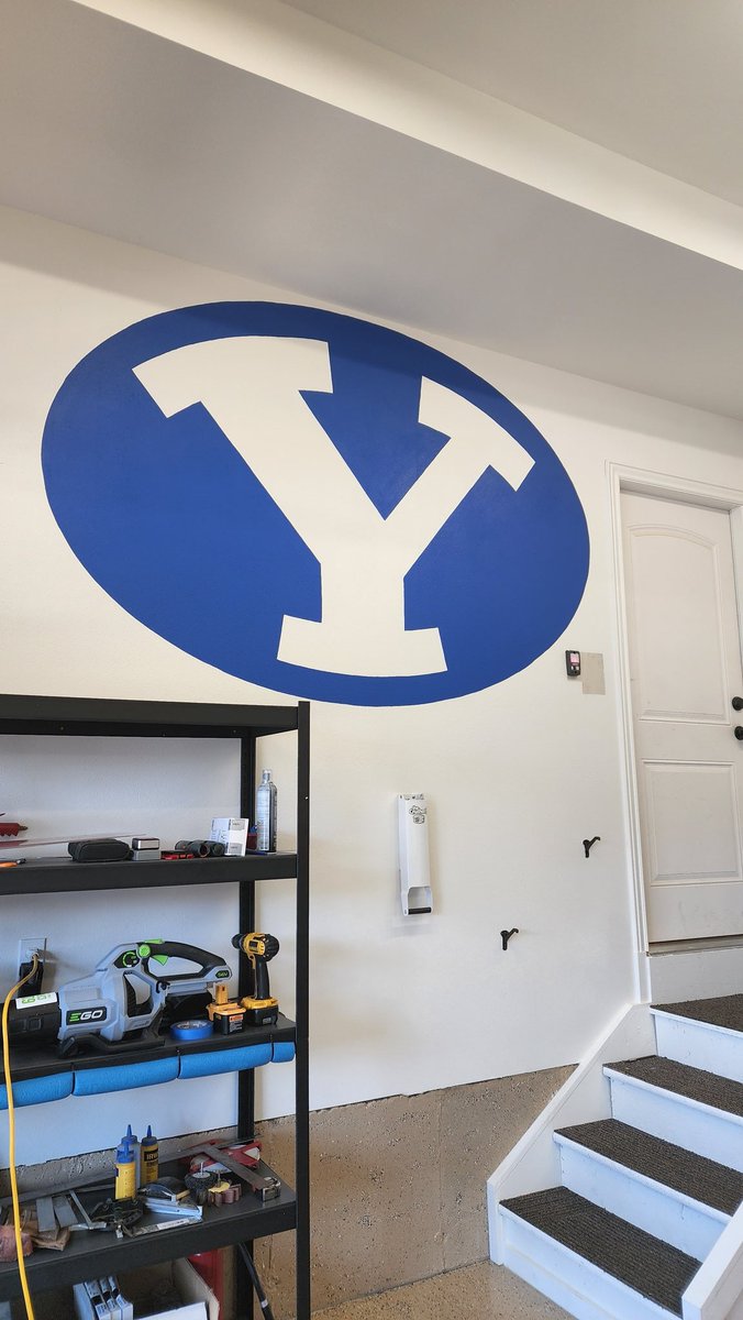 kiraterry's tweet photo. We're ready for the season over here. Helped my dad paint a #BYU logo on his new garage wall today. His request: make it big &amp; royal blue. Check &amp; check, dad. #BYUFootball #gocougsgo https://t.co/EHCSUoMVhc