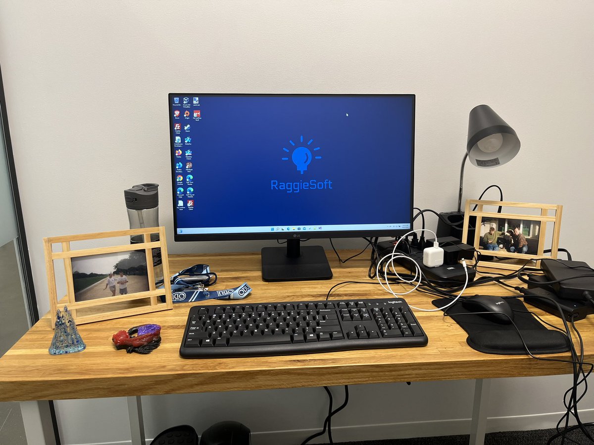 raggiesoft's tweet photo. Suitable writing space for us. Picture of my cousin and I on the left, picture of my late uncle and his #doggie on the right. Now to figure out this mess of wires (the desk belongs to the landlord) https://t.co/IwCLmgBghj