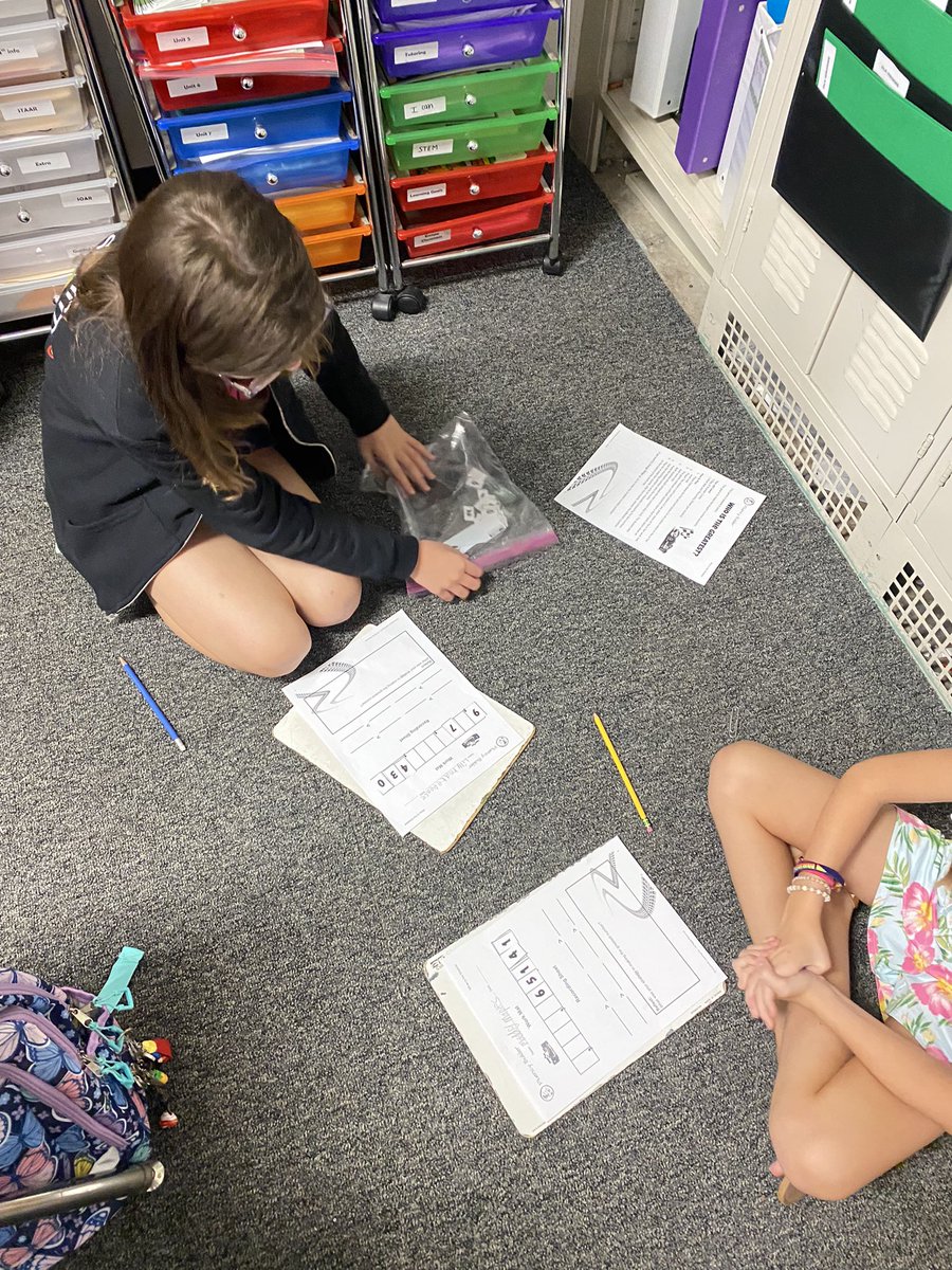 Students worked together to compare and order whole numbers.