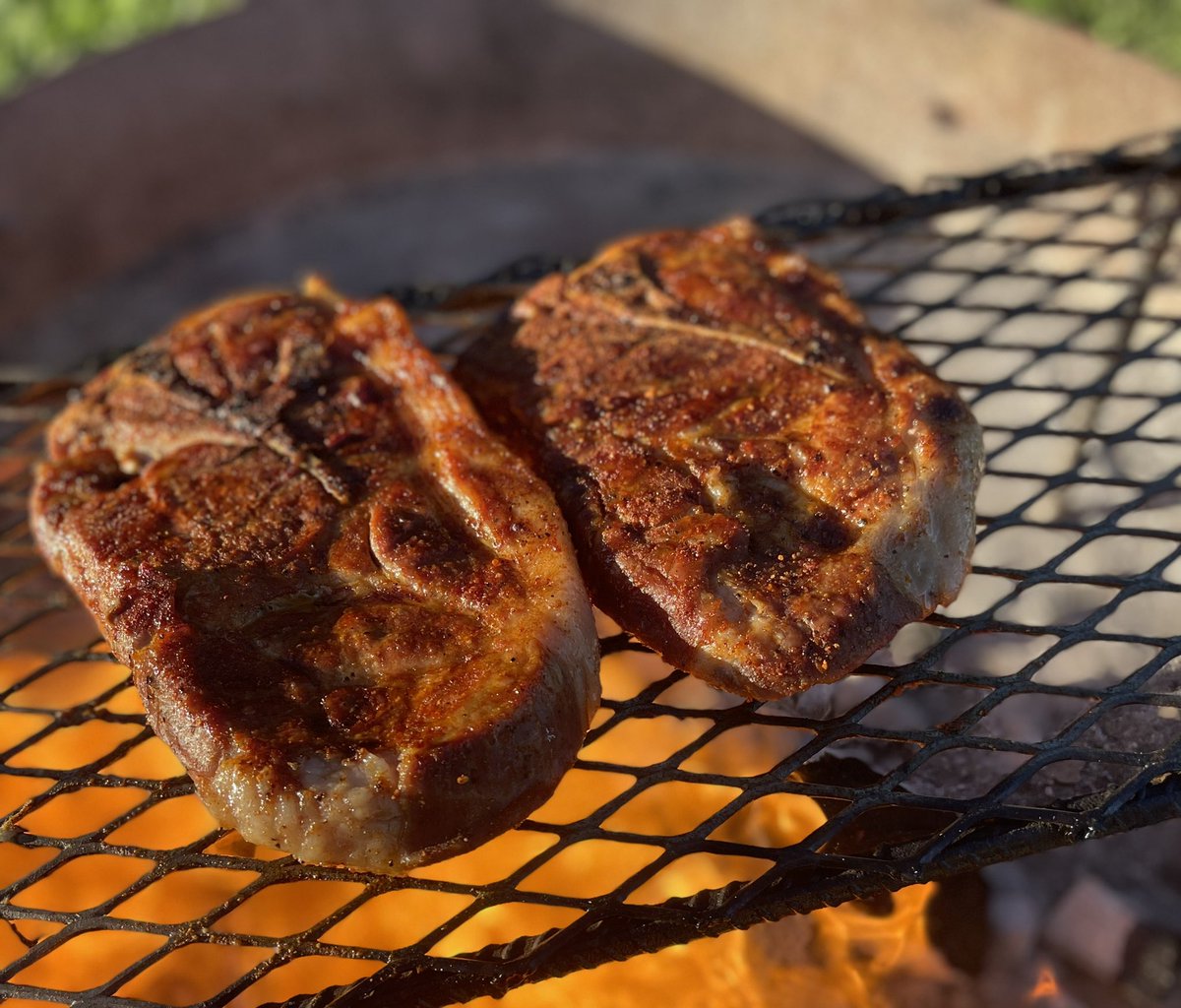 Thick cut pork steaks over the open fire!!

#nombrechutup #openfirecooking #livefirecooking