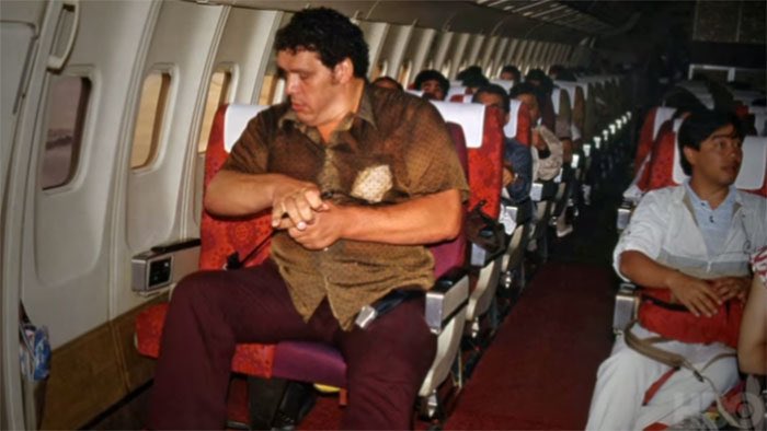 HistoryInPics's tweet photo. André The Giant On A Plane Traveling To Japan, 1980 https://t.co/K1VlnR7JkE