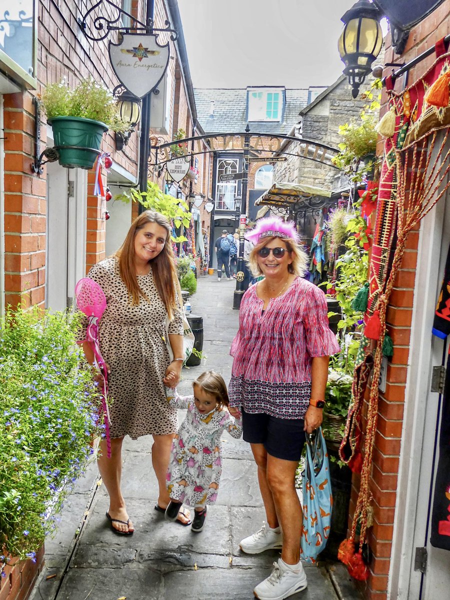 Wonderwomandebz's tweet photo. One of my favourite daily outfit shots from my holiday to UK, especially as it features my daughter &amp; gdaughter! What a great look, I’m wearing my gdaughter’s pink fairy headdress while walking around Glastonbury! #ootd #thisis61 #outfitoftheday #over60style #carryononly https://t.co/qC6A5OZjrM