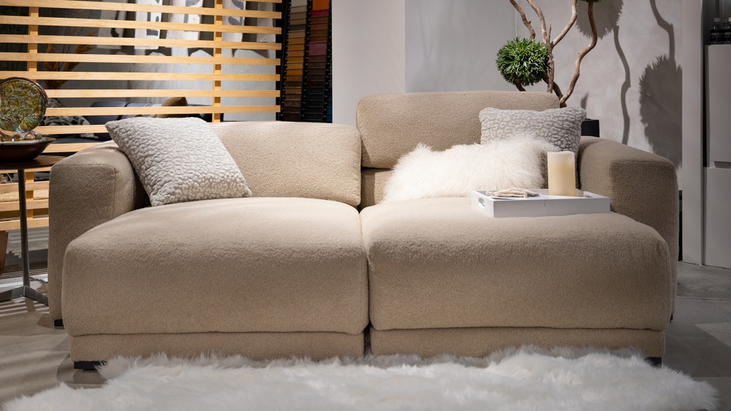 Ah, luxury... Dolly Alpaca just begs to be paired with lavishly fluffy textures! A plush statement rug and plenty of throw pillows is just what this Malibu sofa needs for a cozy respite in the busy High Point Market showroom! l8r.it/6q54