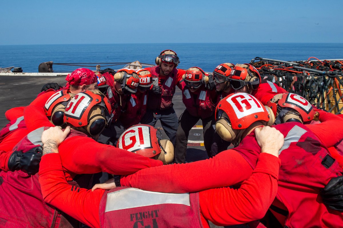 Where my red shirts at?? Sailors huddle on the flight deck during a vertical replenishment with USS George H.W. Bush #CVN77 in the #IonianSea. #GiveEmHell @USNavyEurope