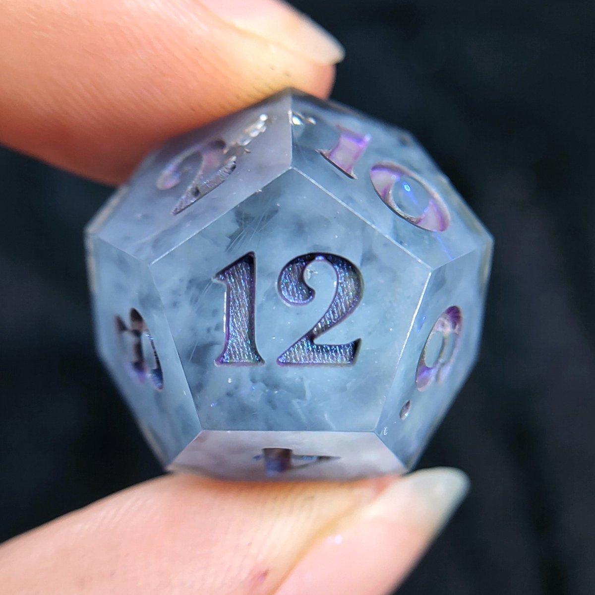 242_dice's tweet photo. IKOSA'S IRE - Storm clouds with hints of violet lightning warn of the Wrath of Ikosa in this handmade dice set. 🌩️
This subtle variant of Ikosa's Wrath is currently up for grabs in my shop! 👀 Check my IG for a video!
#242dice #handmadedice #dnddice #lightningdice #diceset #d20 https://t.co/gfpzsJCzJT