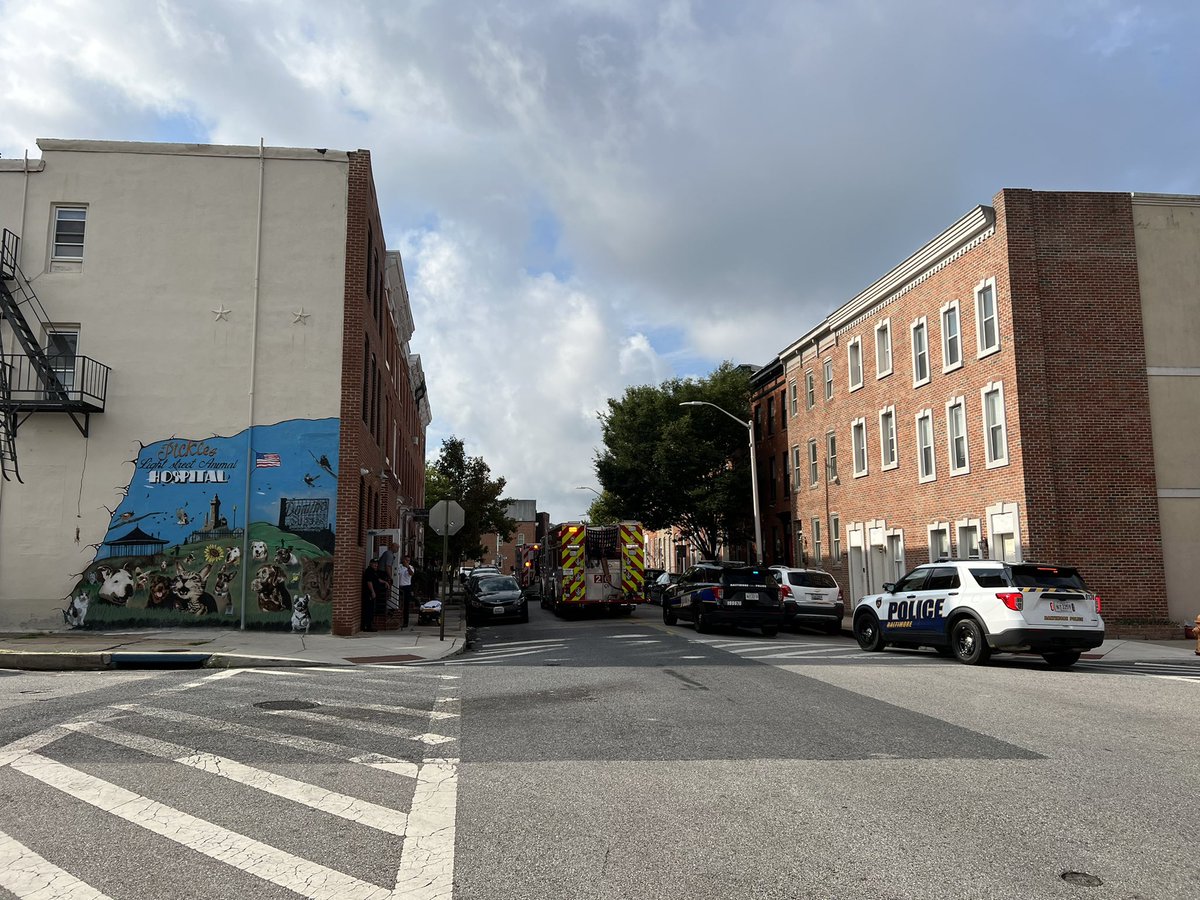 justin_fenton's tweet photo. On first day of school, big police response unfolding near Thomas Johnson Elementary/Middle but for reported shooting on upper floor of Light Street Animal Hospital building, preliminary info has suspect barricaded inside https://t.co/DmLMcNddws
