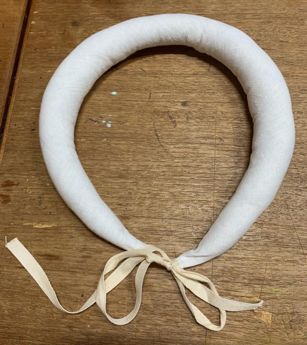 toadspool's tweet image. I finished up my early 17th century petticoat and hiproll.
 The petticoat is made of a medium weight wool and has a yellow guard pieced of scrap wool I had on hand. The waist ties together with wool tape sewn into the waistband. The hip roll is linen stuffed with wool batting.