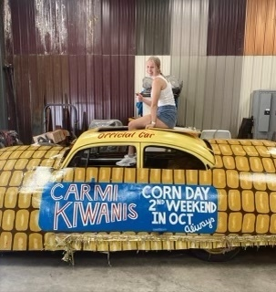 CWCHS's tweet photo. CWCHS senior art student Katelyn Niehaus volunteered her time to repaint the Corn Car for Kiwanis to be featured in the upcoming Corn Day Parade. The car was originally painted by another CWC student, Kelsey Maloy in 2005.  Awesome job, Katelyn! https://t.co/tsMkXHwcTY