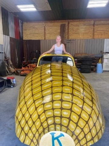 CWCHS's tweet photo. CWCHS senior art student Katelyn Niehaus volunteered her time to repaint the Corn Car for Kiwanis to be featured in the upcoming Corn Day Parade. The car was originally painted by another CWC student, Kelsey Maloy in 2005.  Awesome job, Katelyn! https://t.co/tsMkXHwcTY