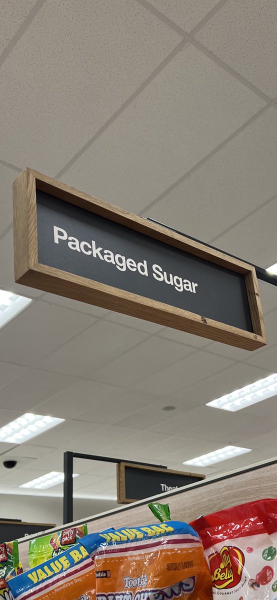 ZachryLibrary's tweet photo. This aisle label at Target amused me. It is a truthful label for those bags of candy. If you want to learn about staying healthy with good food choices, visit the 613 area of our Dewey section! @NISDZachry @NISDLib #packagedsugar https://t.co/9pQUNBBom6