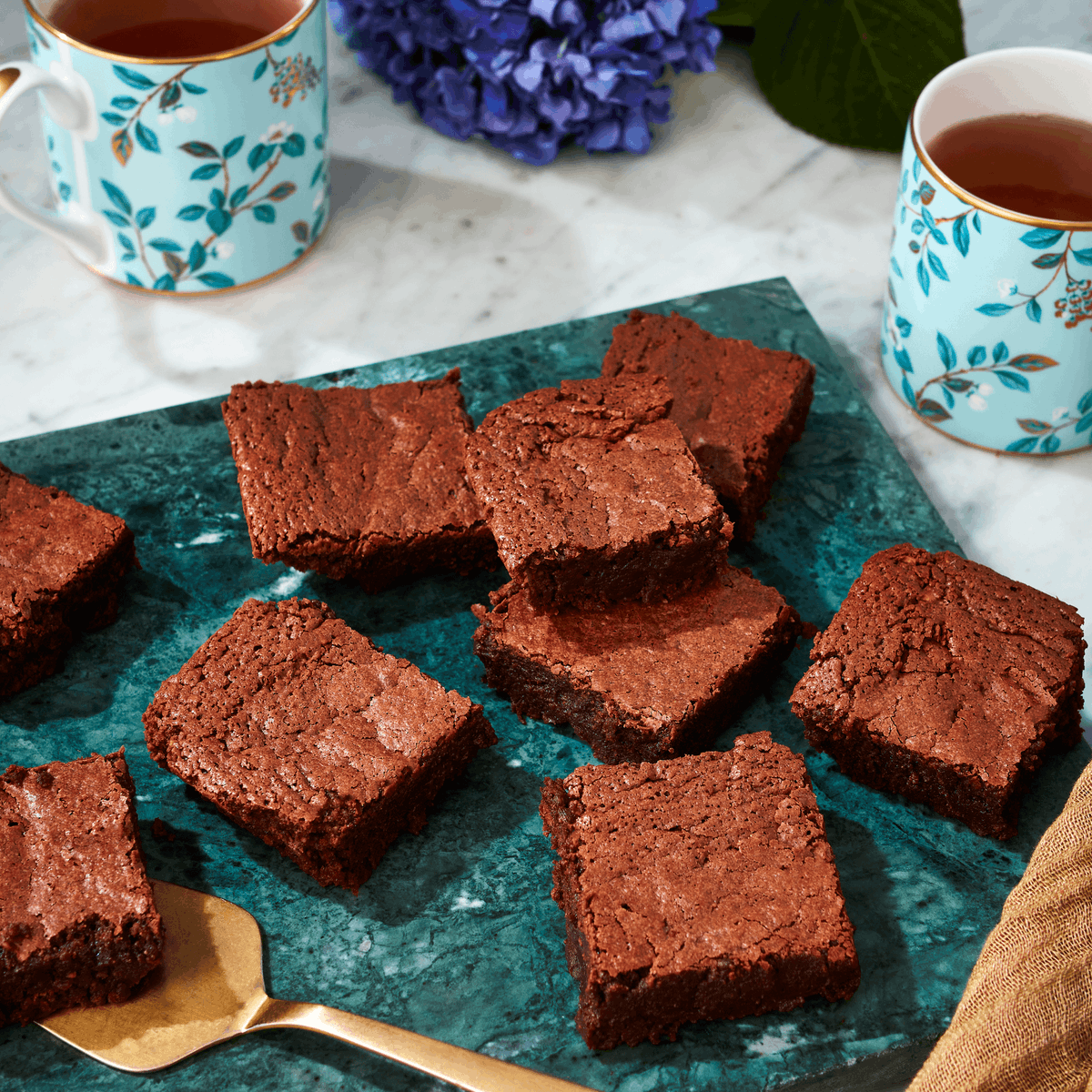Fortnums's tweet image. Say hello to Fortnum's first-ever brownie! 👋🍫 Handmade in small batches with the finest Colombian Dark Chocolate at @explodingbakery, our brand-new Giant Almond Brownie is rich, fudgy and impossible to resist. 
Made for sharing, but we won't tell... > bit.ly/3QHt91b