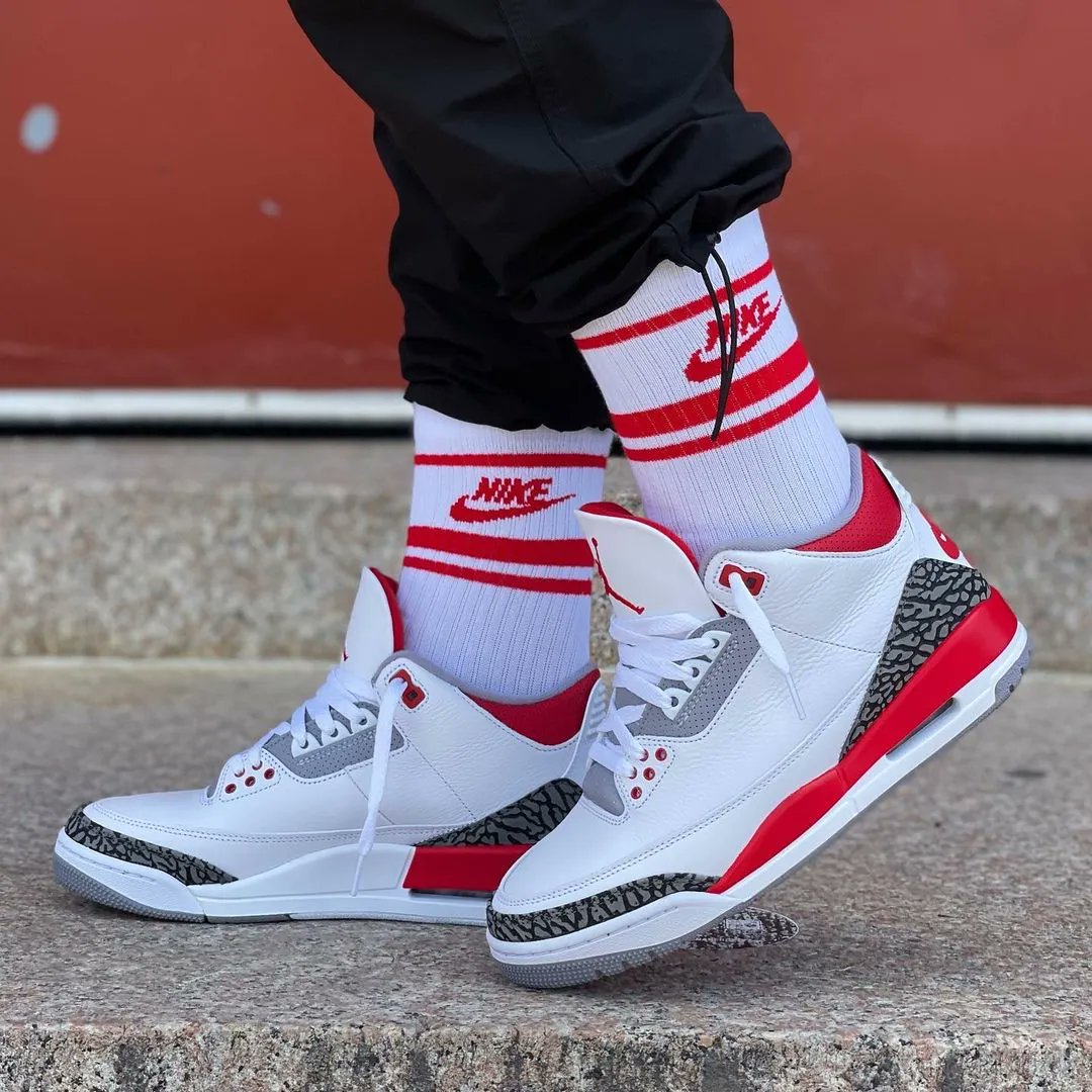 fire red denim 3s on feet