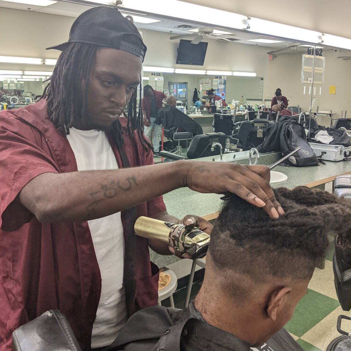 Edward Course working on a client.